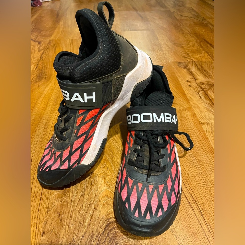 Boombah Pink, orange fade turf cleats